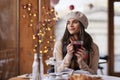 Pretty young woman daydreaming while drinking tea in the cafe Royalty Free Stock Photo