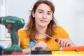 Pretty young woman doing DIY work at home Royalty Free Stock Photo