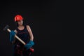 Pretty young woman doing repairs at home. Portrait of a female construction worker. Building, repair concept. Royalty Free Stock Photo