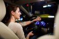 Pretty, young woman driving her modern car Royalty Free Stock Photo