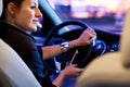 Pretty, young woman driving her modern car Royalty Free Stock Photo