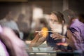 Pretty, young woman eating sushi in a restaurant Royalty Free Stock Photo