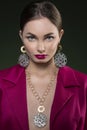 Beuty portrait of model in fuchsia magenta dress with jewelry