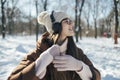 Pretty young woman enjoy winter day with music