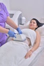 Pretty young woman getting cryolipolyse fat treatment in profess Royalty Free Stock Photo