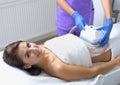 Pretty young woman getting cryolipolyse treatment Royalty Free Stock Photo