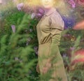 Pretty young woman in gold dress on buddleia field of wheat. Portrait of tender woman on a field Royalty Free Stock Photo