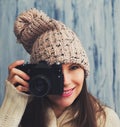 Pretty young woman in hat with vintage camera Royalty Free Stock Photo