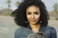 Pretty young woman beside her car making phone call Royalty Free Stock Photo