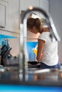 Pretty, young woman in her kitchen, fixing lunch Royalty Free Stock Photo