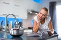 Pretty, young woman in her  kitchen Royalty Free Stock Photo