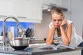 Pretty, young woman in her  kitchen Royalty Free Stock Photo