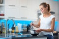 Pretty, young woman in her modern kitchen Royalty Free Stock Photo