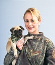 Pretty young woman with her pet Pug