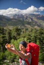 Pretty, young woman hiker taking a selfie photo Royalty Free Stock Photo