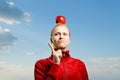 Pretty young woman holding appleon the head Royalty Free Stock Photo