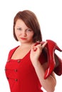 Pretty young woman holding bright red shoes Royalty Free Stock Photo