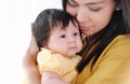 Pretty young woman holding a newborn baby in her arms. Happy family concept Royalty Free Stock Photo