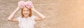 Pretty young woman holding peony bloom like wreath