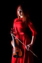 Pretty young woman holding a violin Royalty Free Stock Photo
