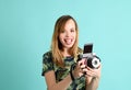 Pretty young woman with instant camera