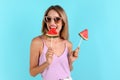 Pretty young woman with juicy watermelon