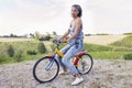 Pretty young woman on little bike Royalty Free Stock Photo