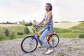 Pretty young woman on little bike