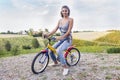 Pretty young woman on little bike Royalty Free Stock Photo