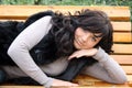 Pretty young woman lying on bench Royalty Free Stock Photo