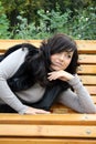 Pretty young woman lying on bench Royalty Free Stock Photo