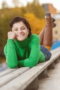 Pretty young woman lying on bench Royalty Free Stock Photo