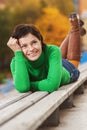 Pretty young woman lying on bench Royalty Free Stock Photo