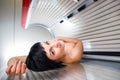 Pretty young woman in a modern solarium Royalty Free Stock Photo