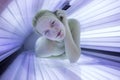 Pretty young woman in a modern solarium Royalty Free Stock Photo