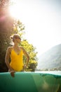 Pretty, young woman paddling on a paddle board on a lake Royalty Free Stock Photo