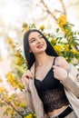 pretty young woman posing against a blooming cherry in spring garden Royalty Free Stock Photo