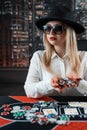 Pretty young women posing at playing table in casino Royalty Free Stock Photo