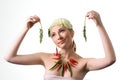 Woman with peppers and cabbage leaf holding plants Royalty Free Stock Photo