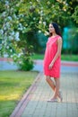 Pretty young woman posing at the spring blooming garden Royalty Free Stock Photo