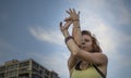 Pretty Young Woman Practicing Yoga in the Park (Eagle Pose) Royalty Free Stock Photo