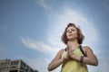 Pretty Young Woman Practicing Yoga in the Park (Prayer Hands) (Tree Pose) Royalty Free Stock Photo