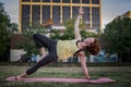 Pretty Young Woman Practicing Yoga in the Park (Side Plank) Royalty Free Stock Photo