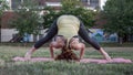 Pretty Young Woman Practicing Yoga in the Park (Tripod) Royalty Free Stock Photo