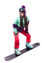 Pretty young woman in purple ski suit rides black snowboard Royalty Free Stock Photo