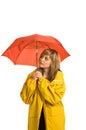 Pretty young woman in raincoat with umbrella