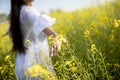 Young woman in the rapeseed field