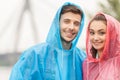 Pretty young woman in red raincoat.