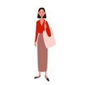 A pretty young woman in a red sweater with a plunging neckline and a long beige skirt with a shopper bag. A woman with