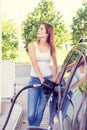 Pretty young woman refuel the car Royalty Free Stock Photo
